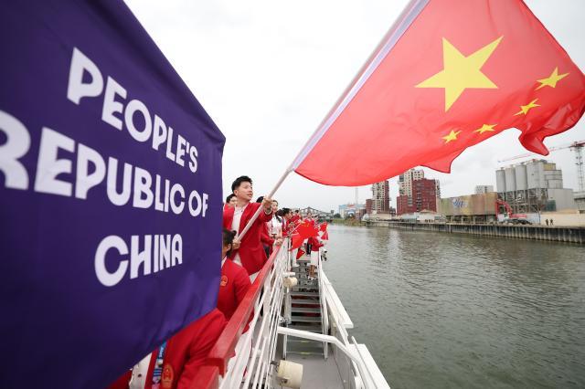 买马挣钱网站app-【图集】中国体育代表团正式亮相 马龙挥舞五星红旗