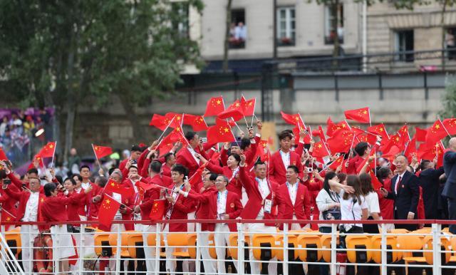 买马挣钱网站app-【图集】中国体育代表团正式亮相 马龙挥舞五星红旗