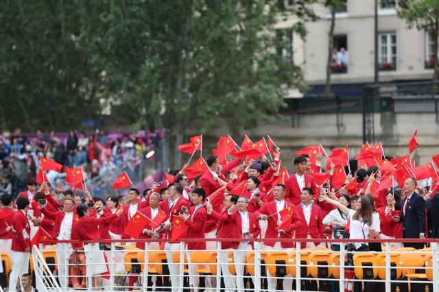 买马挣钱网站app-【图集】中国体育代表团正式亮相 马龙挥舞五星红旗