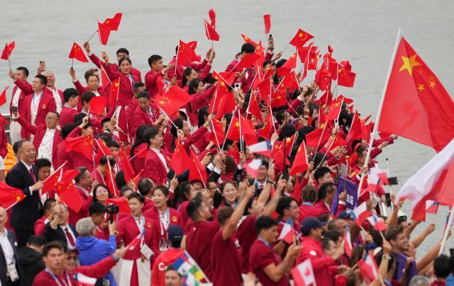 买马挣钱网站app-【图集】中国体育代表团正式亮相 马龙挥舞五星红旗