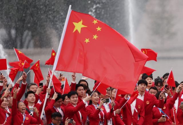 买马挣钱网站app-【图集】中国体育代表团正式亮相 马龙挥舞五星红旗