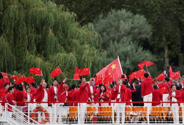 买马挣钱网站app-【图集】中国体育代表团正式亮相 马龙挥舞五星红旗